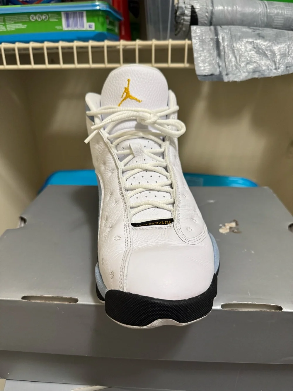 Jordan Men’s White Athletic Shoes with Black and Gold Accents